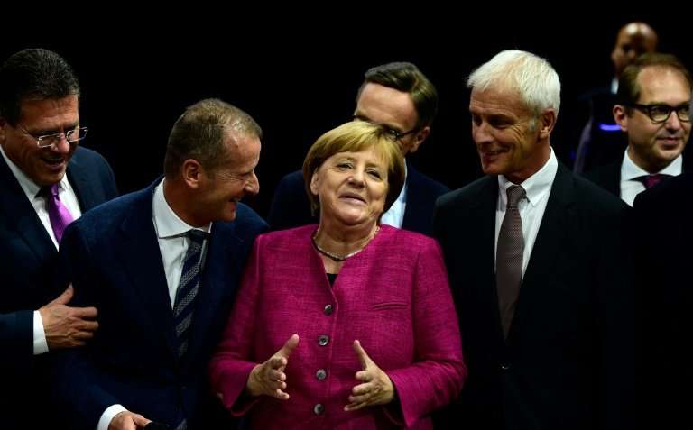 Herbert Diess with German Chancellor Angela Merkel and now former Volkswagen CEO Matthias Mueller last year at the Frankfurt aut