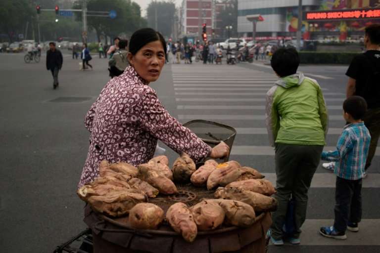 How sweet potatos, seen here hauled by a street vendor in Bejing, spread from South America to Polynesia centuries ago is the su