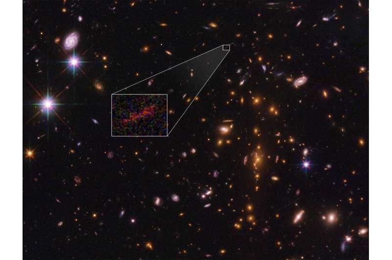 Hubble and Spitzer team up to find magnified and stretched out image of distant galaxy
