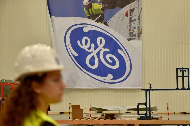 -Industrial giant General Electric is considering breaking up into separate operating units, the company's chief announced