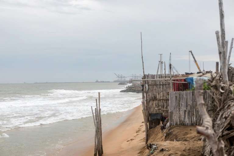 In the beachfront village of Agebkope on Togo's shore, houses have been swept into the sea and others teeter on the brink as coa