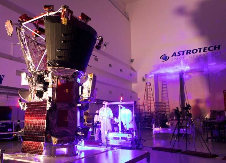 In this image released by NASA, technicians and engineers perform light bar testing on NASA's Parker Solar Probe at the Astrotec