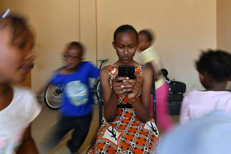 Kenyan schoolgirl Imelda Mumbi uses Eneza, an interactive educational app which has about three million users worldwide