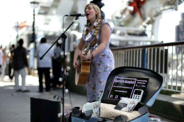 London busker Charlotte Campbell is one of the first performers to use a contactless card reader