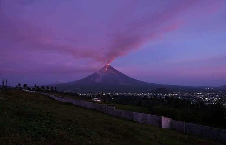 Mayon volcano spews lava ash from its crater during an erruption near Legazpi City in Albay province, where high-end hotels prov