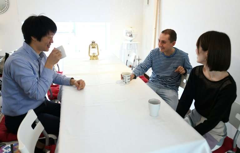 Nobuhide Kaneda (left) rents his apartment to Max Ikeda (back right), a Ukrainian-Japanese living in Hiroshima