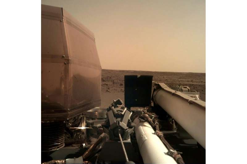One of the first images taken by the Mars InSight lander and released by NASA after the probe landed on the surface of the Red P