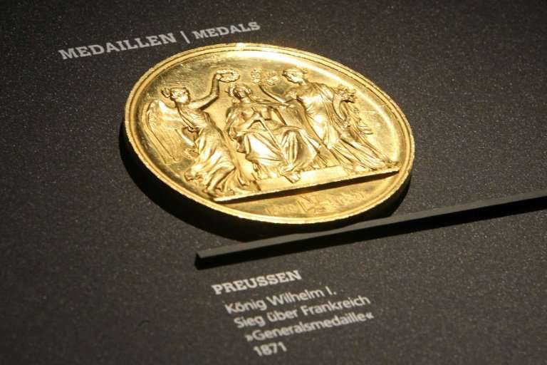 Out with the new, in with the gold: an 1871 medal on display at the Money Museum