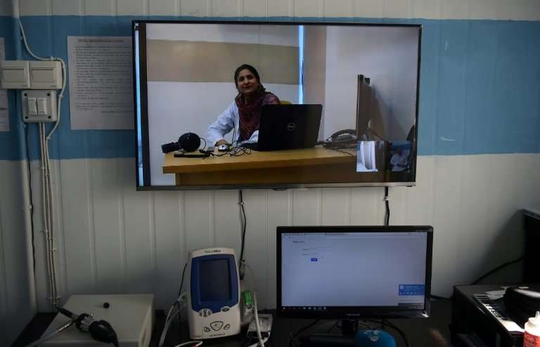 Pakistani doctor Nadia Rasheed speaks during an interview with AFP via Skype at a government-run online treatment centre