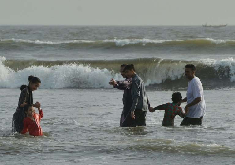 Pakistanis cool off at a beach as the country's  largest city, Karachi, swelters in temperatures of 42 degrees Celsius