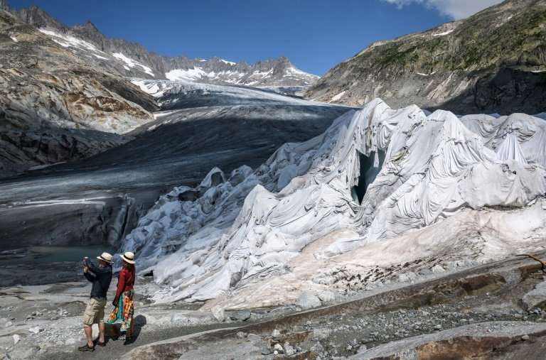 Part of the Rhone Glacier is covered with insulating foam to prevent it from melting during the August 2018 heatwave that swept 