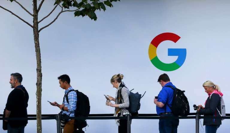People wait in line to enter a Google product launch event in San Francisco, California