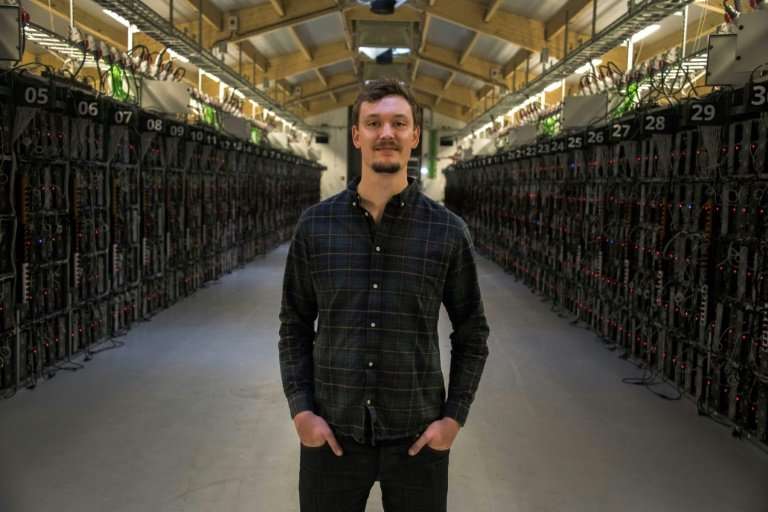 Philip Salter, head of operations at Genesis Mining, inside the company's bitcoin &quot;farm&quot;