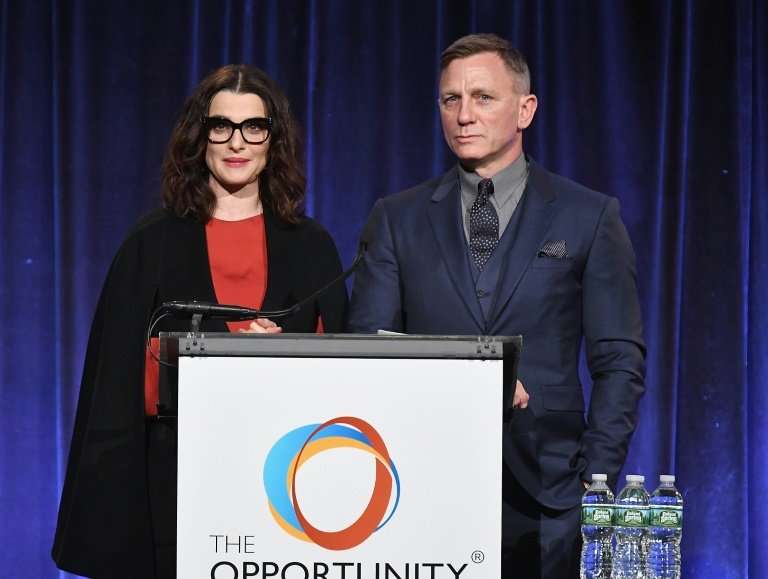 Rachel Weisz and Daniel Craig attend a fundraiser for The Opportunity Network, to which Craig is donating proceeds from the sale