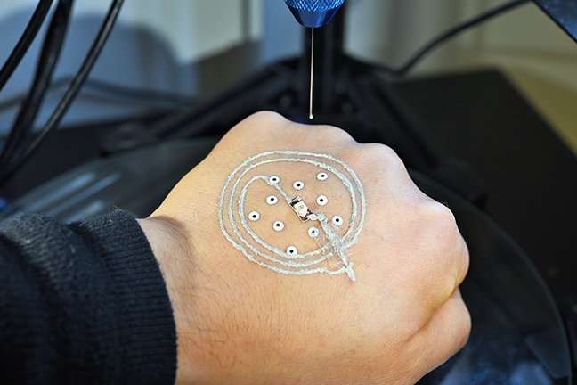 Researchers 3-D print electronics and cells directly on skin