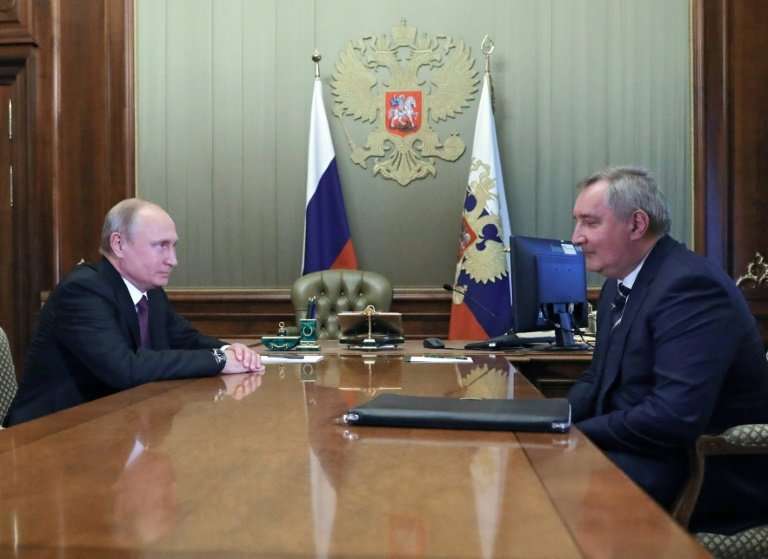 Russian President Vladimir Putin (left) meets appointed former deputy prime minister Dmitry Rogozin to head the country's space 