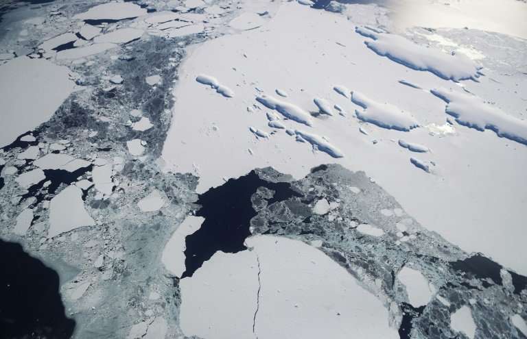 Sea ice floats around a group of islands (TOP R) as seen from NASA's Operation IceBridge research aircraft off the coast of the 