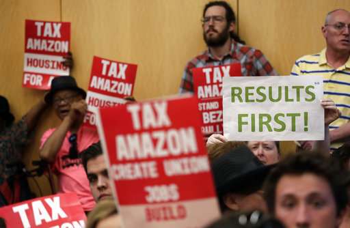 Seattle OKs taxing companies like Amazon to aid the homeless