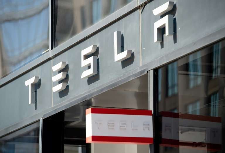 Shares in electric car maker Tesla leapt in after-market trades following the company's quarterly earnings report