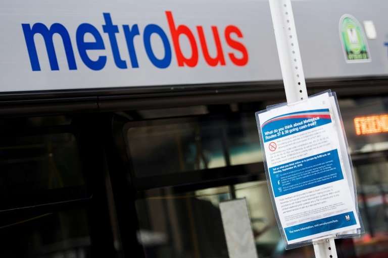 Signs around Washington asked commuters: what do you think about buses going cash-free?