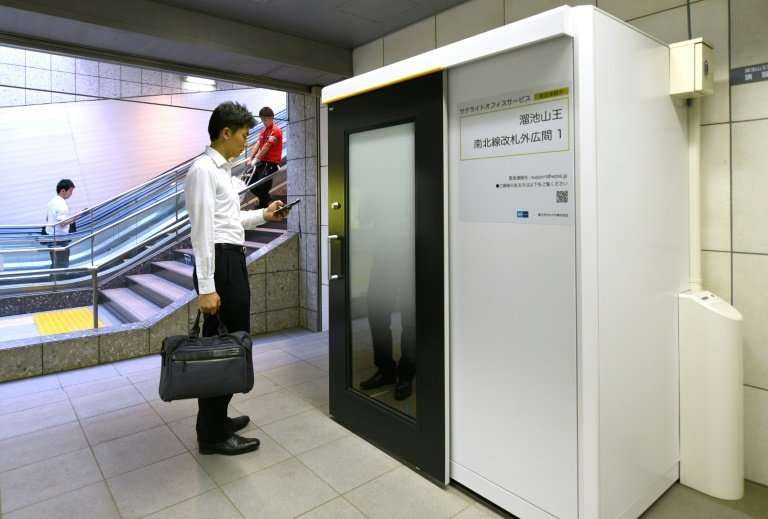 Some stations on Tokyo's metro now boast office cubicles equipped with desk, chair, computer display and wifi