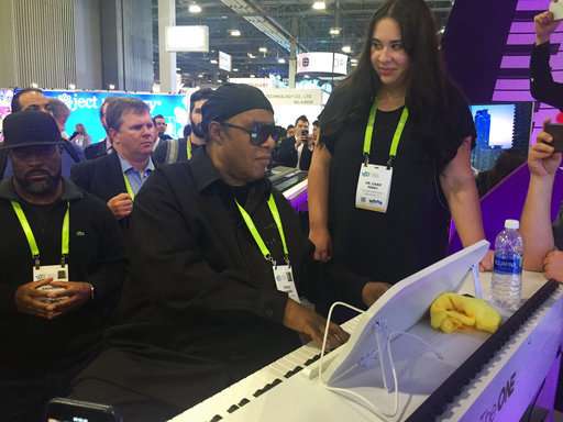 Stevie Wonder wows crowd on 'smart' piano at tech show