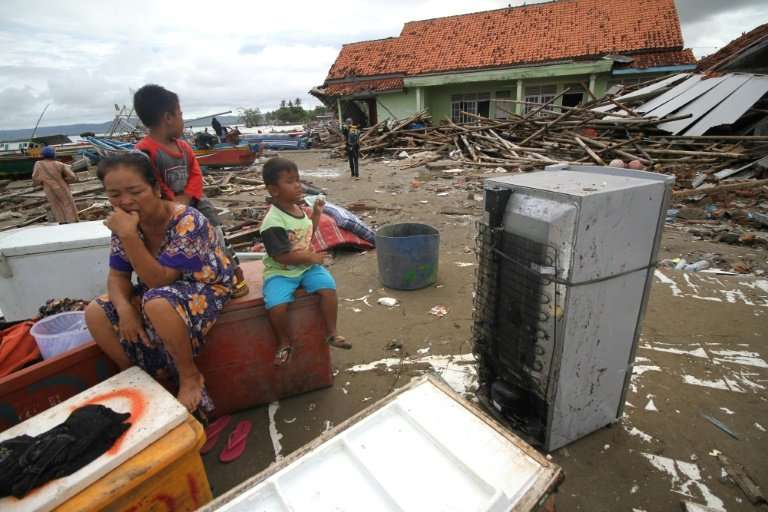 Survivors from Sumur on Java island returned to salvage items from destroyed or damaged homes