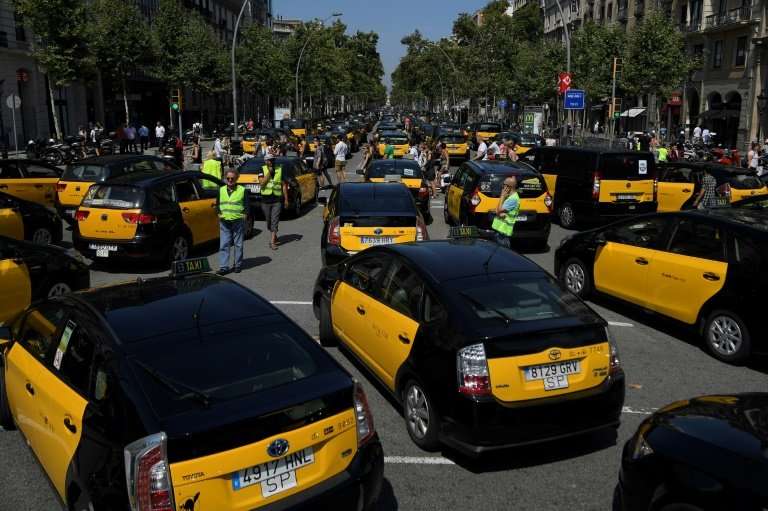Taxi drivers blocked the Gran Via in Barcelona on July 27, 2018 during a strike. Taxi drivers in Madrid joined the action on Jul