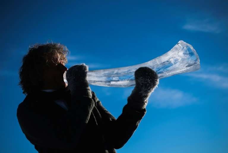 Terje Lsungset, the founder and artistic director of the Ice Music Festival, tests a musical instrument made out of ice