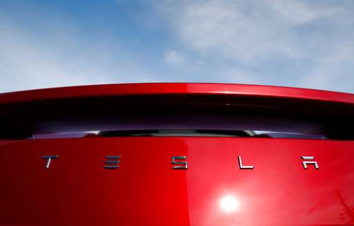 Tesla burns $739.5 million in cash on way to record 2Q loss
