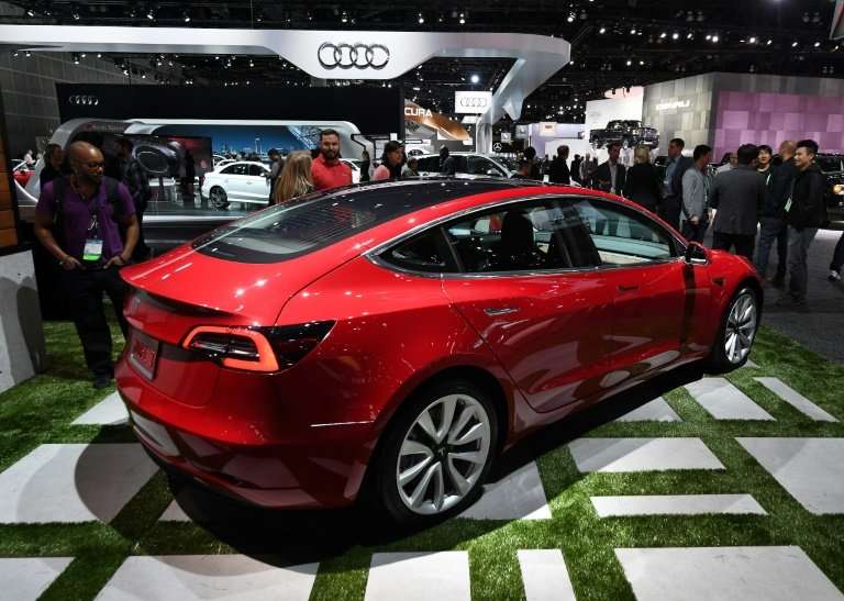 Tesla chief Elon Musk said a company reorganization aims to speed up production of the Model 3, a key to expansion of the electr