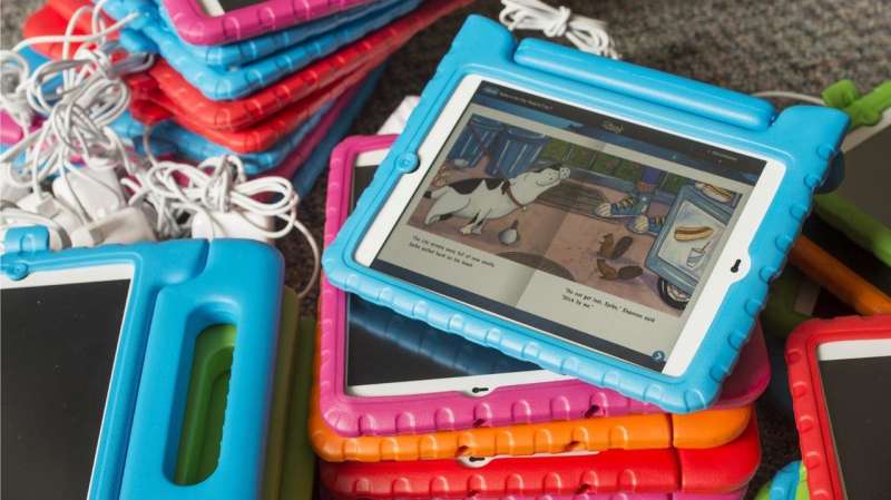 Texts and tablets more than double time parents spend reading to kids