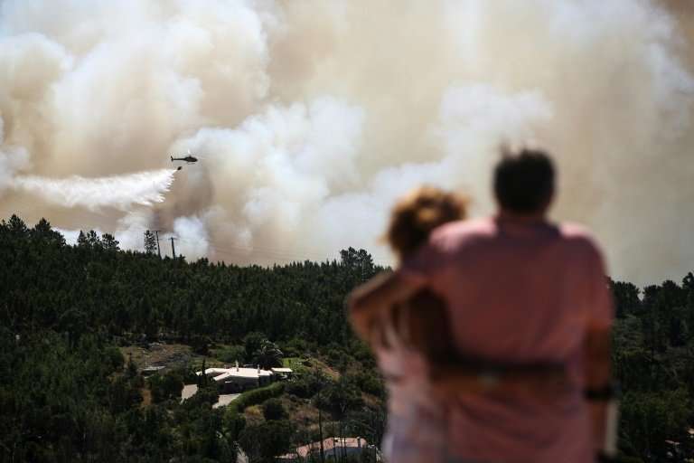 The fires have left 32 people injured, one seriously, and forced hundreds from their homes as the flames encircled urban areas i