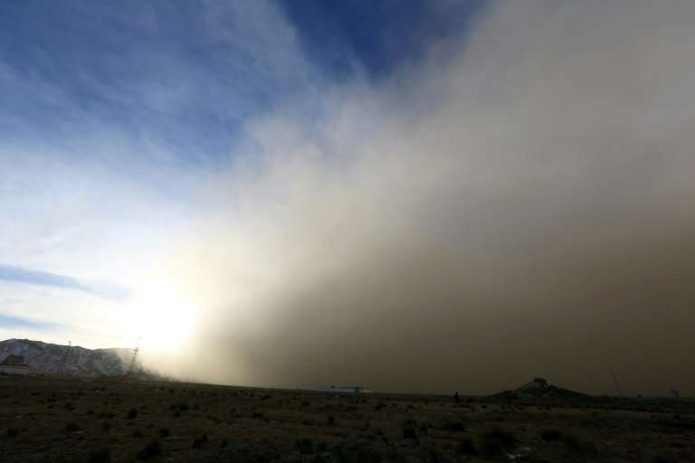 The sandstorm is seen rolling into Zhangye in China's northwestern Gansu province