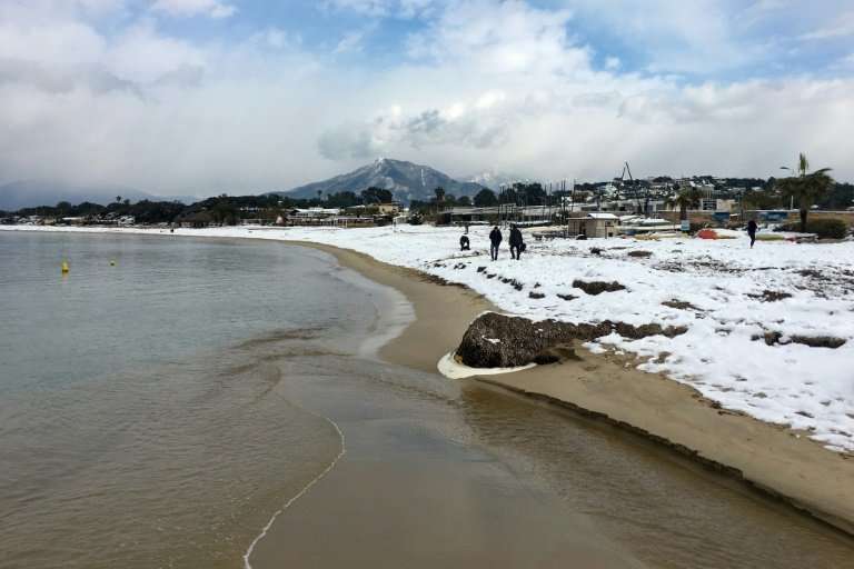 The shore of the bay of Ajaccio covered with snow, on the French Mediteranean island of Corsica