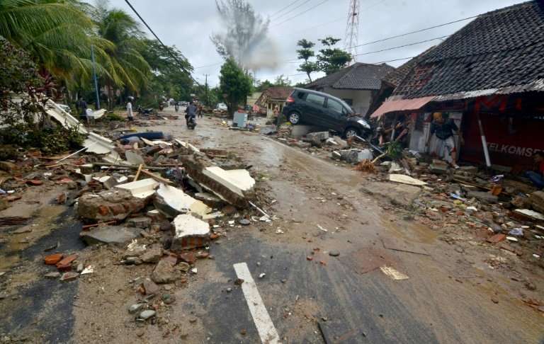 The tsunami left a trail of destruction in Carita, destroying buildings and tossing cars aside