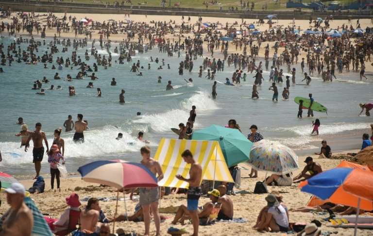 Thousands have flocked to the beach to cool down as temperatures touch 40 degrees Celsius