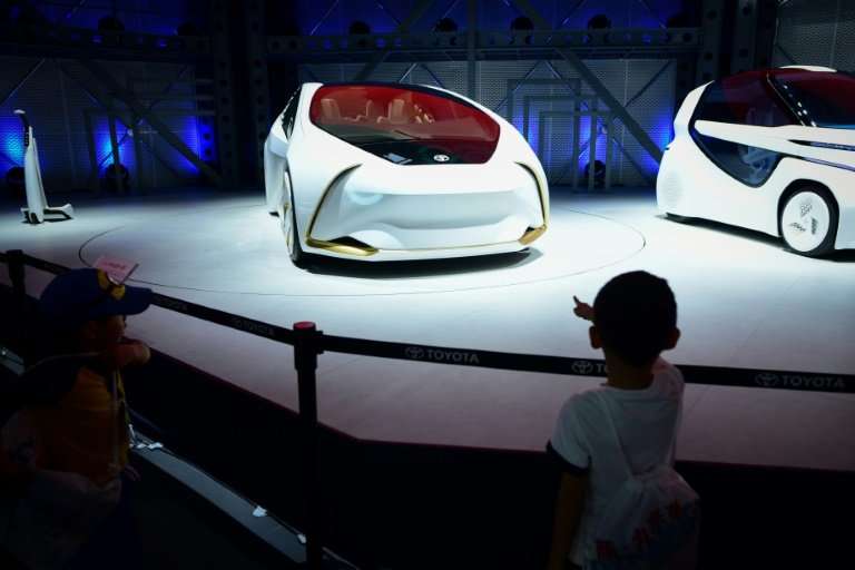 Toyota showed its i Ride concept car at the Beijing auto show, an electric vehicle with automated driving that is easy to enter 