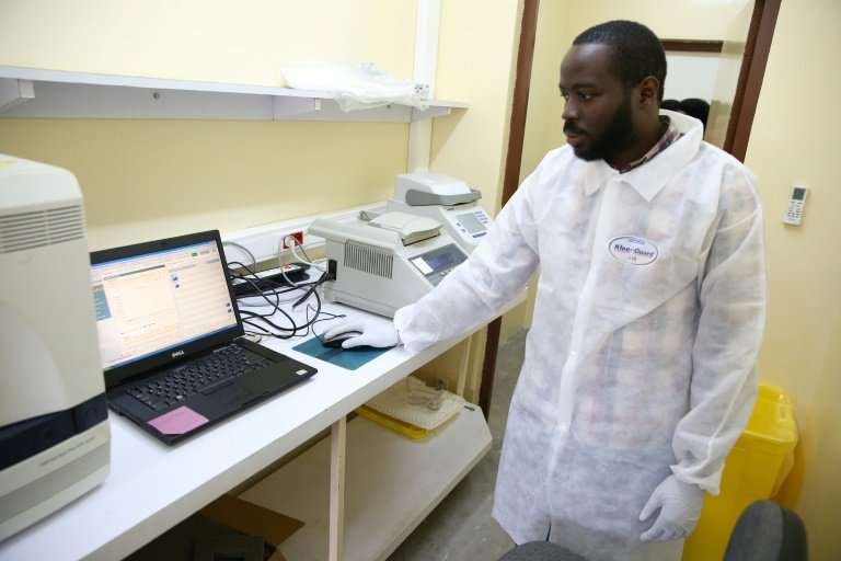 Viral sleuth: doctor Illich Mombo analyses the results of an Ebola test at the Franceville International Centre for Medical Rese