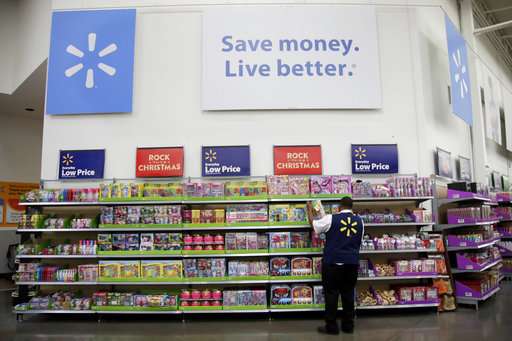 Walmart takes bruises from Amazon battle in fourth quarter