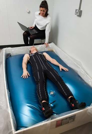 Waterbeds simulate weightlessness to help skinsuits combat back pain in space