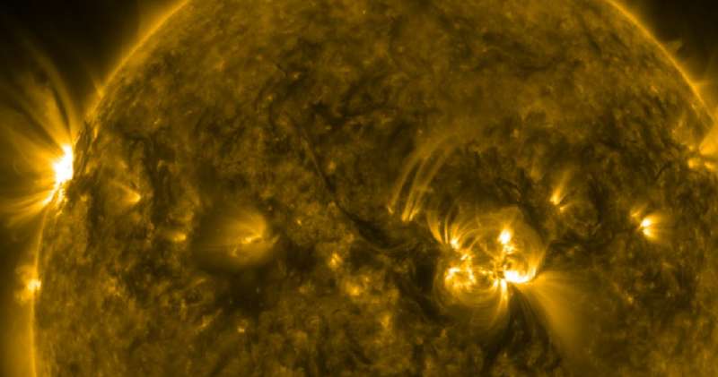 Why does the Sun's corona sizzle at one million &deg;F? Team of physicists is unearthing clues