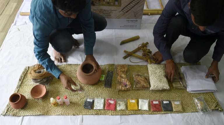 Workers at SarvaPooja''s manufacturing unit in Mumbai prepare a 'final rites kit', which includes a number of items including co