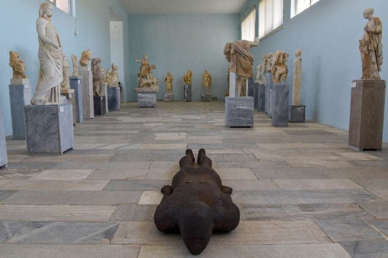Antony Gormley's steel sculpture 'Shift II' lies among sculptures from ancient Greece dating back more than 2,000 years