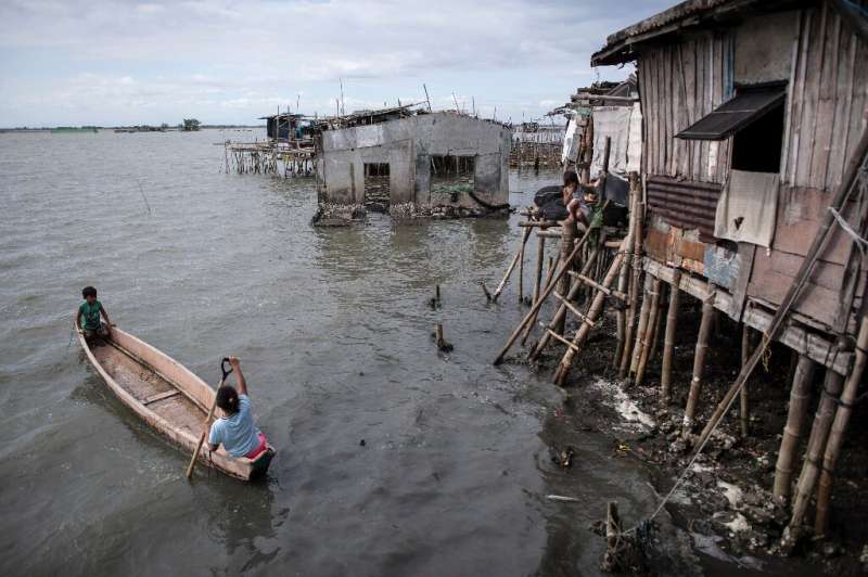 At least 5,000 people have been forced out of the mostly rural coastal areas north of Manila in recent decades as the bay water 