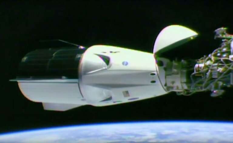 A video grab taken from a NASA/SpaceX webcast transmission on March 3, 2019 shows SpaceX Dragon capsule docked at the Internatio