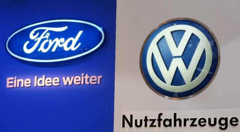 Ford (L) and Volkswagen (VW, R) are teaming up  to develop self-driving cars and related technology