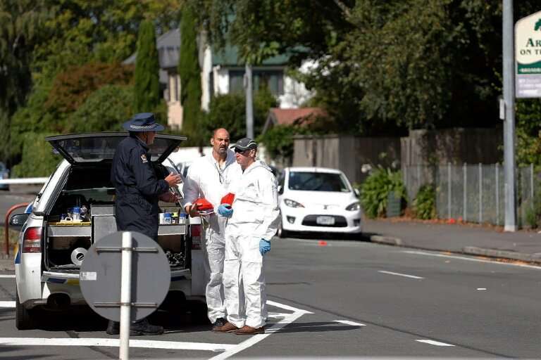 Forensic experts collect evidence near one of the attacked mosques in Christchurch