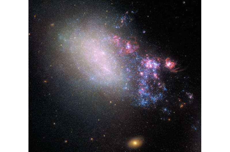 Galaxy blazes with new stars born from close encounter