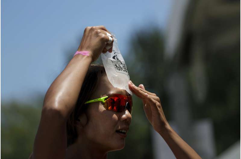 Hoses, ice packs help tame Tokyo heat before the Olympics